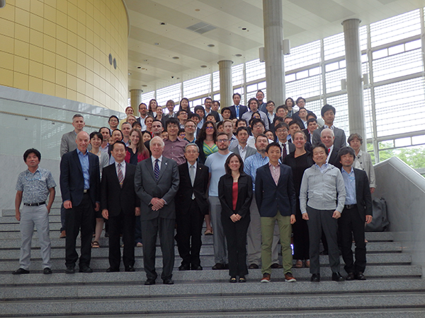 Greg stands with a group at the NAE conference in Japan